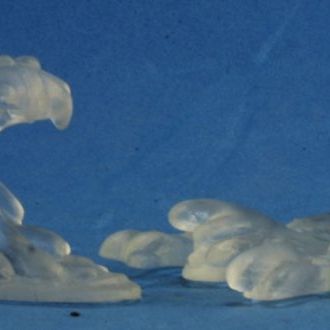 Reaper Miniatures translucent slime figures from the Reaper: Translucent Slimes set, showing green, semi-transparent monster miniatures.