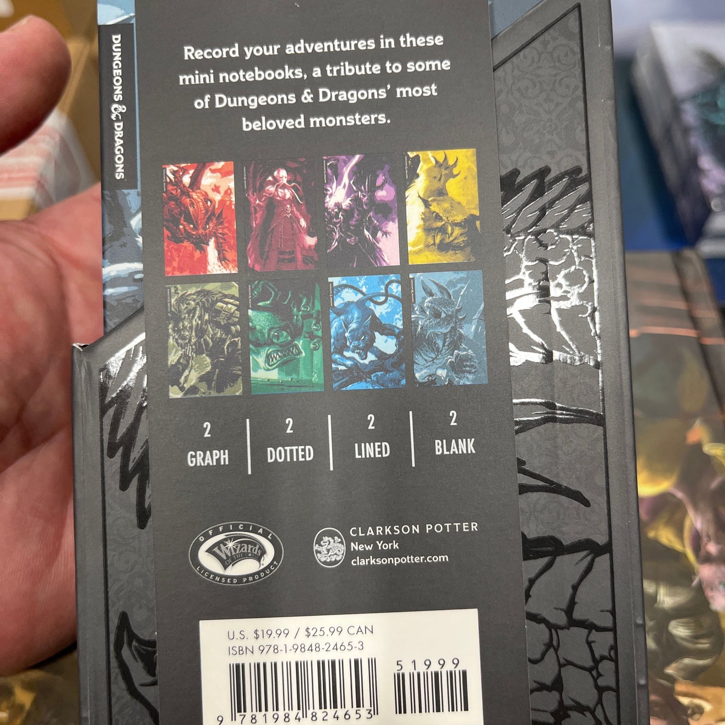 Two D&D Bestiary 8 mini notebooks by Wizards of the Coast featuring fantasy creature illustrations and compact design.