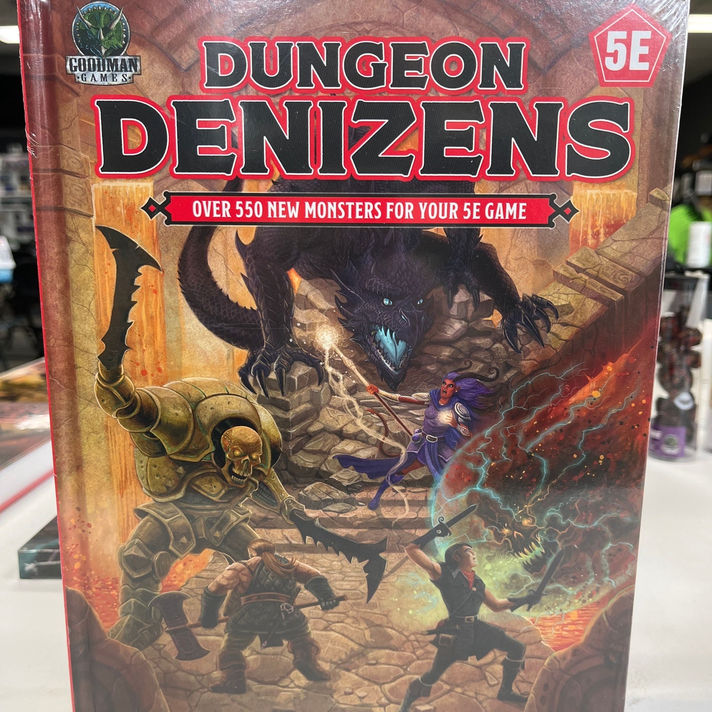 D&D 5E Dungeon Denizens RPG book by Goodman Games with colorful cover art featuring fantasy creatures and dungeon scenes.