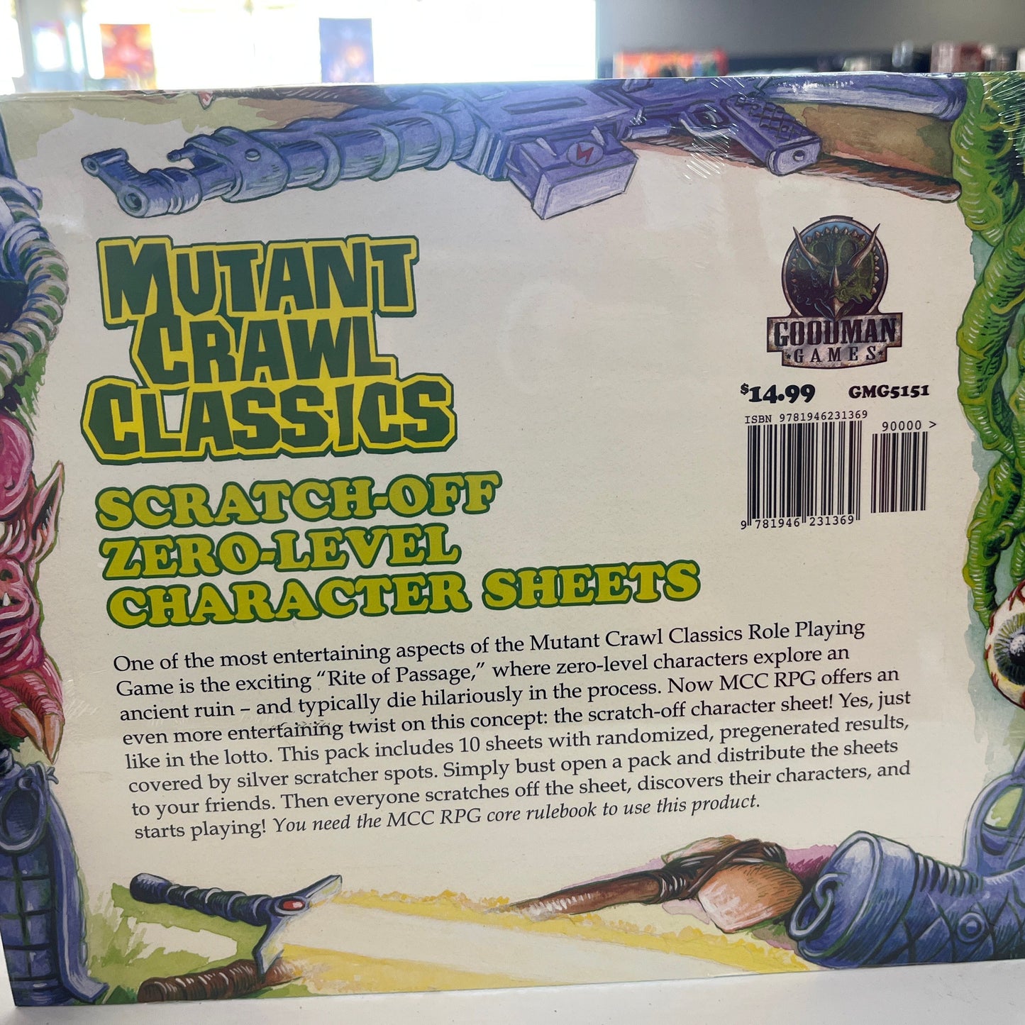Open book showing Mutant Crawl Classics MCC scratch-off character sheets for levels 0-1 from Goodman Games RPG series.