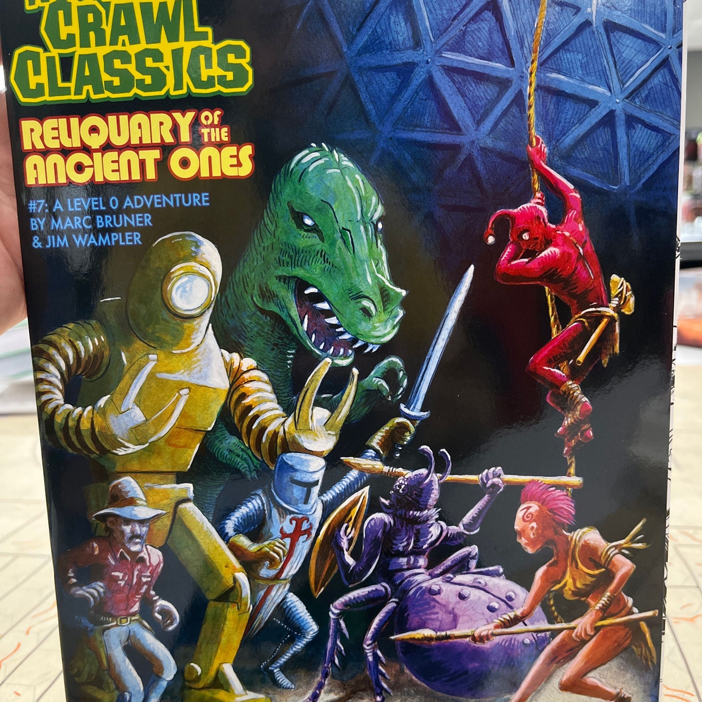 Open RPG book titled Reliquary of the Ancient Ones by Goodman Games, featuring detailed cover art and interior pages.