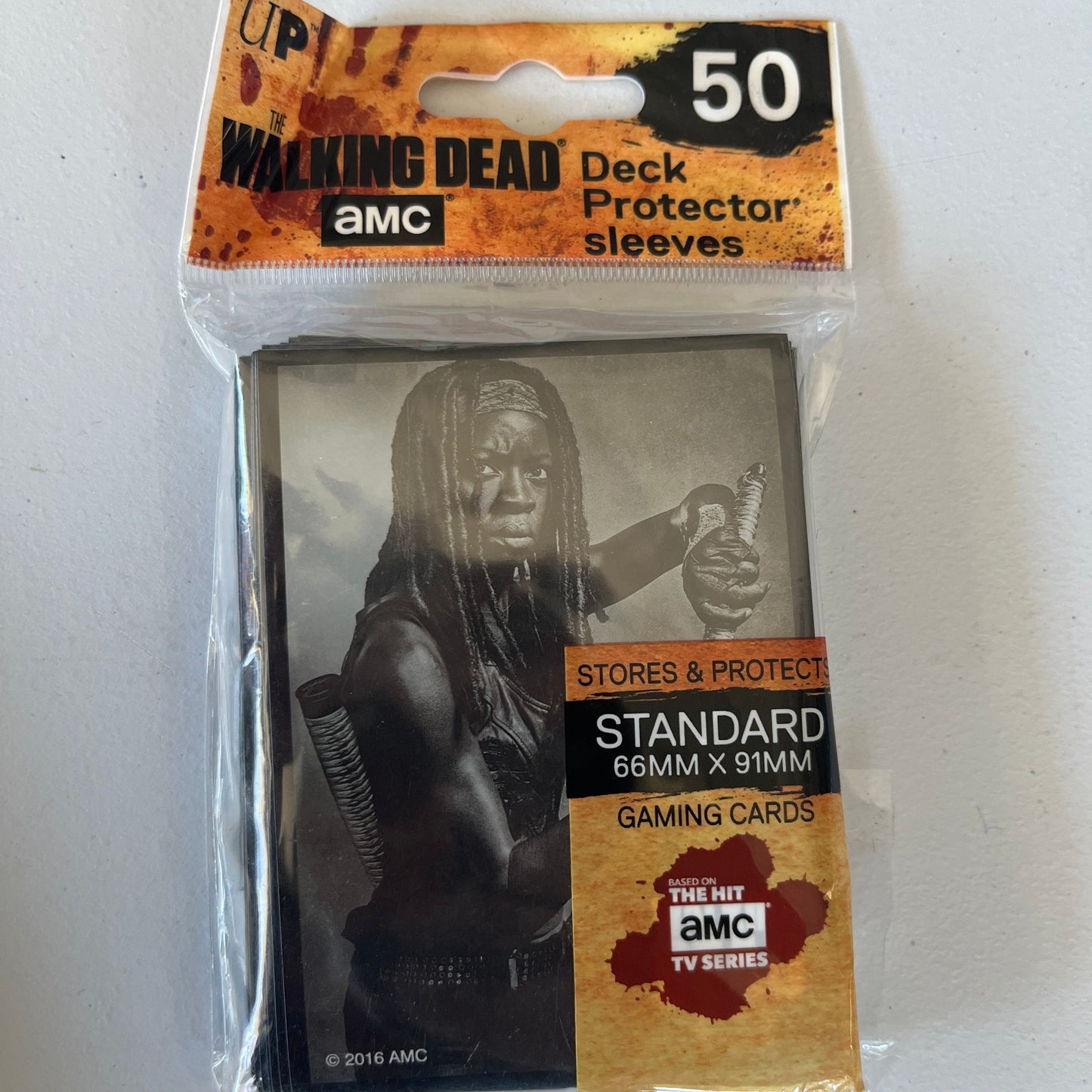 Ultra Pro Walking Dead card sleeves featuring Michonne design, set of 50, protective plastic sleeves for collectible trading cards.