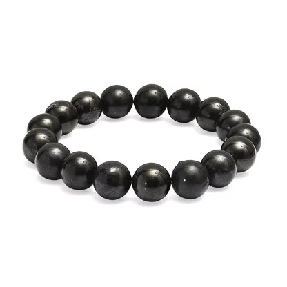 Natural Stone bracelet by Creepy Crystals featuring polished gemstone beads in earthy tones on an elastic cord.