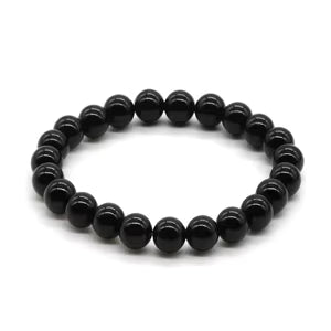 Natural stone bracelet by Creepy Crystals featuring various polished stones on an elastic band, close-up view of the bracelet.