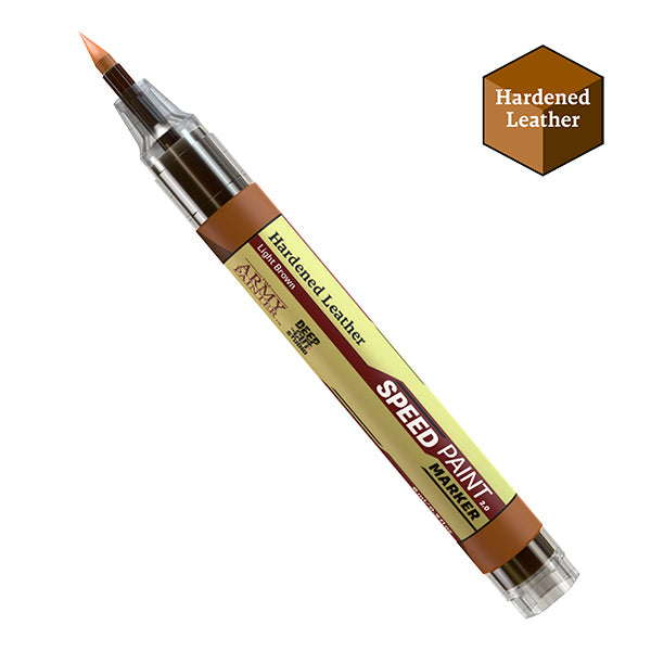 The Army Painter Speedpaint Markers in various colors arranged on a wooden surface, ideal for art and hobby projects.
