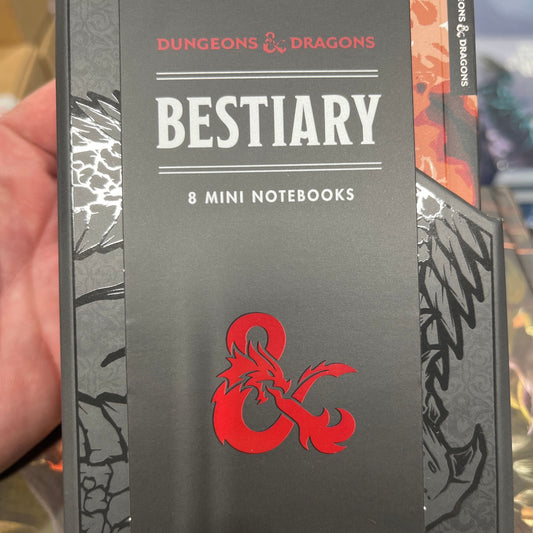 Set of three D&D Bestiary 8 mini notebooks by Wizards of the Coast, featuring fantasy-themed cover artwork and compact size.